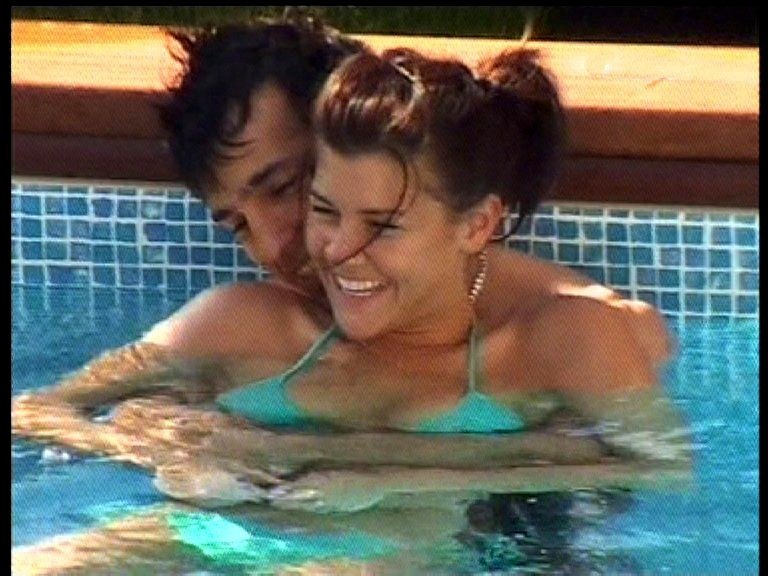 Imogen Thomas and Sezer Yurtseven flirting in a pool.