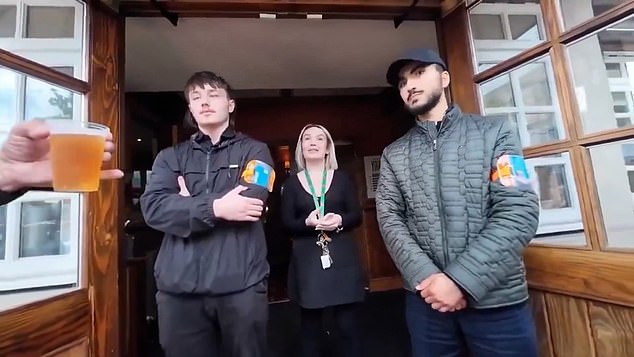 By this point, a small crowd had joined the man filming, taking videos of their own and chipping in with complaints about the pub's rules