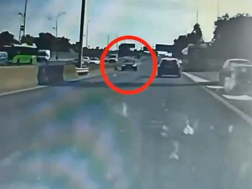 Dashcam footage of a car driving the wrong way on a motorway.
