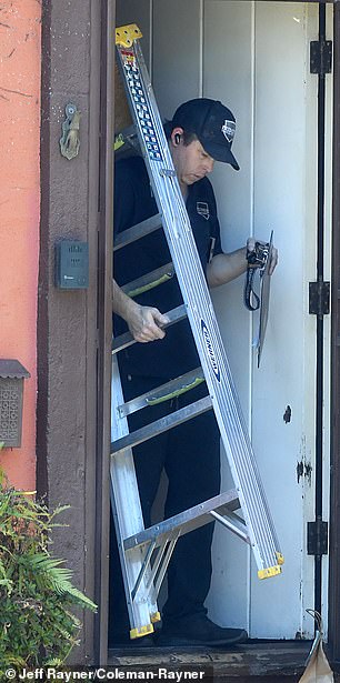 The exterminator walking out of Rourke's home after the appointment wrapped up