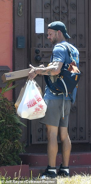 The actor's assistant arriving back with food and packages after completing daily tasks