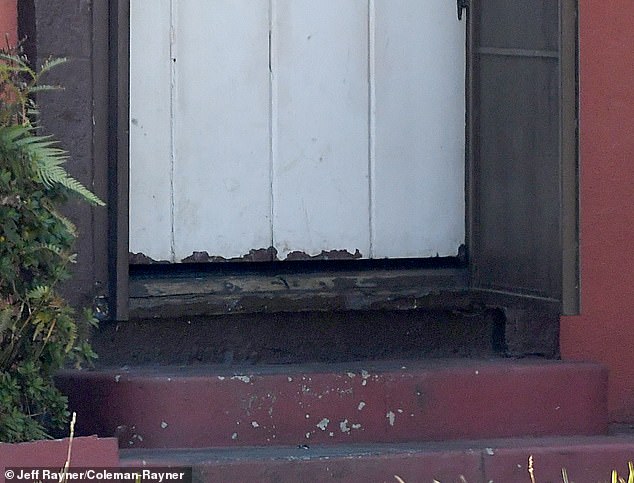 The bottom of his front door had a clear gap underneath showing, and the paint was chipped, while the wood frame showed signs of rot