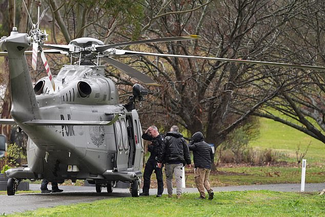 A police helicopter amid a search underway for an armed fugitive who the police said shot two police officers, at Feathertop Winery in Porepunkah, Australia, August 27, 2025. Simon Dallinger/AAP Image/via REUTERS    ATTENTION EDITORS - THIS IMAGE WAS PROVIDED BY A THIRD PARTY. NO RESALES. NO ARCHIVE. AUSTRALIA OUT. NEW ZEALAND OUT. NO COMMERCIAL OR EDITORIAL SALES IN NEW ZEALAND. NO COMMERCIAL OR EDITORIAL SALES IN AUSTRALIA.