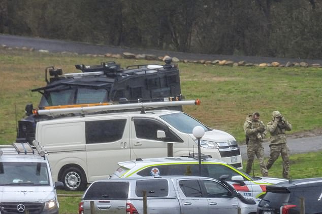 A large contingent of Victorian Police at a staging area at Feathertop Winery in Porepunkah in Victoria, Wednesday, August 27, 2025. A significant search is underway for a "heavily armed" fugitive involved in the 'cold-blooded murder" of two police officers. (AAP Image/Simon Dallinger ) NO ARCHIVING