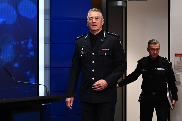 Victoria Police Chief Commissioner Mike Bush arrives to speak to the media during a press conference at Police headquaters in Melbourne, Sunday, August 24, 2025. The Cheif Commission is was prioviding an update on the situation in Porepunkah where two police offers were killed and a third injured. (AAP Image/Joel Carrett) NO ARCHIVING