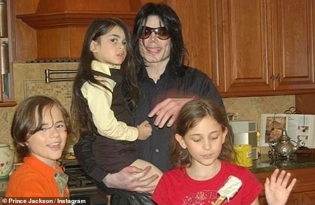 Prince is pictured with his late father and his siblings Paris, now 27, and Bigi, now 23, who at the time this photo was taken was known as Blanket
