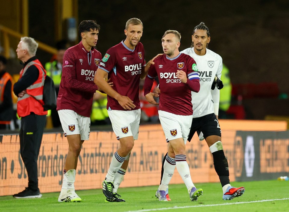 West Ham United players looking dejected after a soccer match.