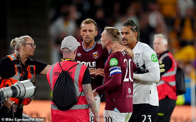 The Hammers skipper had to be pulled away from the advertising hoardings by his team-mates and stewards