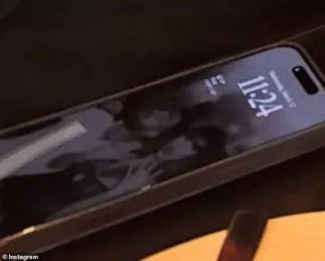 Travis' lock screen appeared to be a picture of himself and Taylor, with the singer spreading out her fingers on her left hand, and a surprised expression on her fact