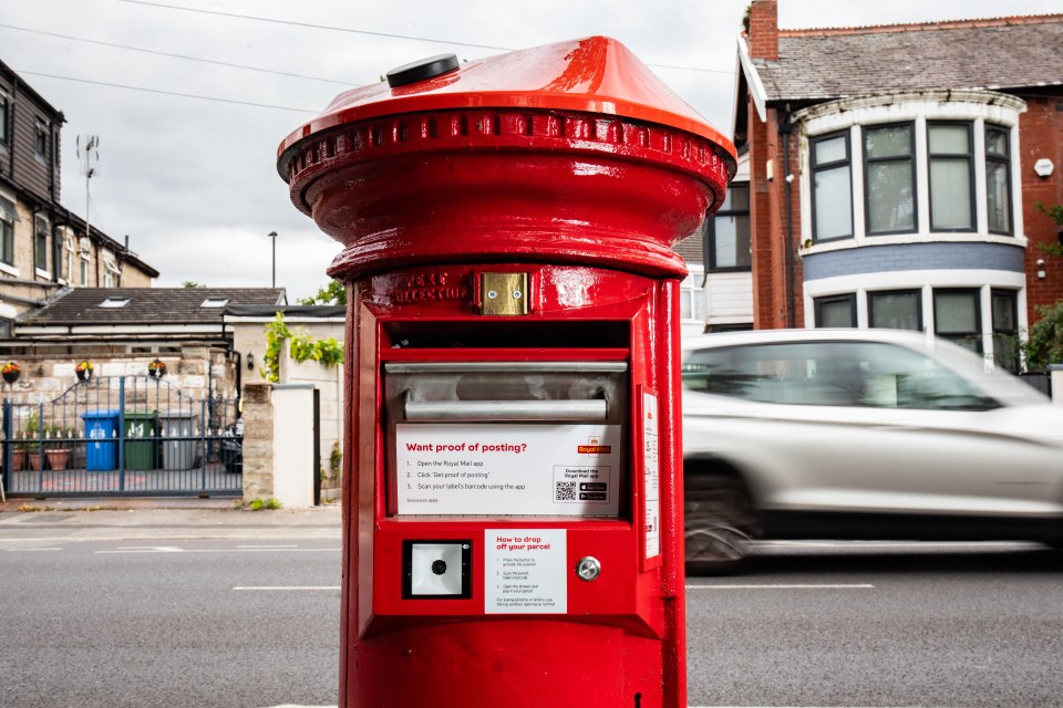 Modern Royal Mail postbox with parcel drop-off slot and barcode scanner.