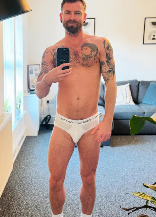 Selfie of a man in white Calvin Klein underwear.