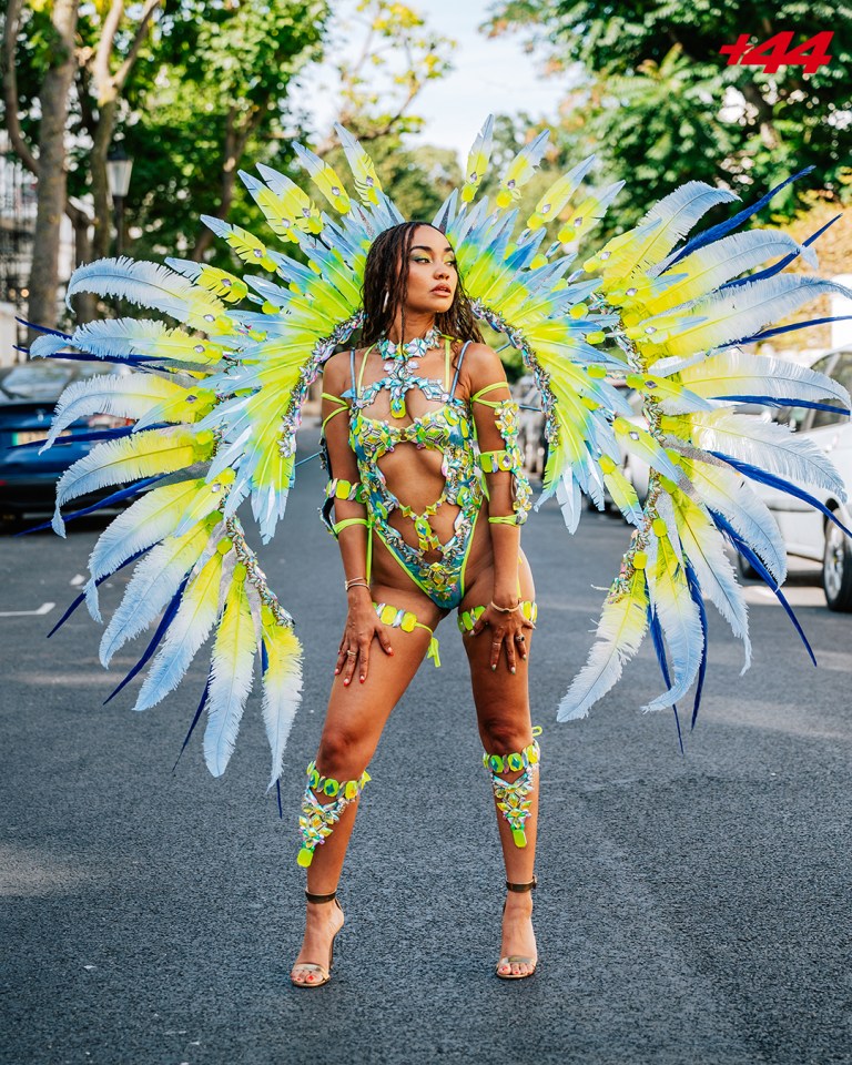 Leigh-Anne Pinnock at Notting Hill Carnival in a vibrant feathered costume.