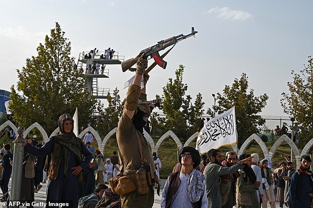 A Taliban guard is pictured earlier this month celebrating the fourth anniversary of the Islamist regime's takeover of Afghanistan