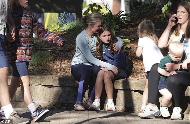 Harrowing images showed terrified parents outside the church as they waited for news of their children