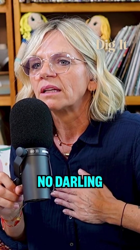 Woman speaking into a microphone; "Dig It" and "No Darling" superimposed on the image.