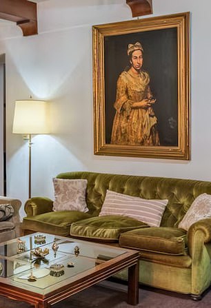 'Portrait of a Lady was pictured hanging over a sofa in a real estate listing posted by Robles Casas & Campos