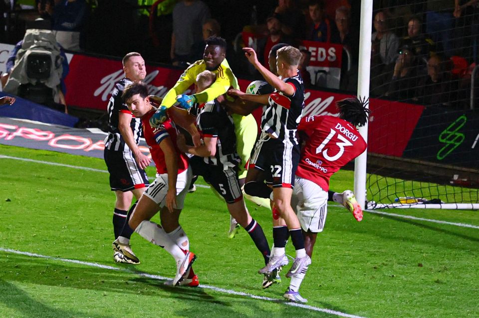 Andre Onana of Manchester United vying for the ball during a soccer match.
