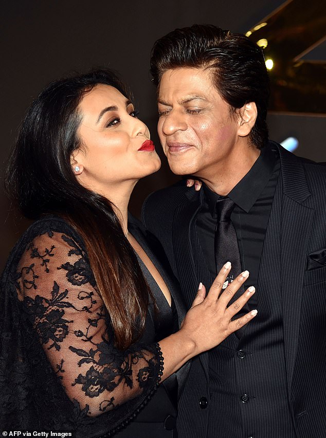 Commenting on the differences between Shah Rukh's appearances in 2018 - at the reunion event for one of his biggest hits - and 2025, an expert told FEMAIL 'his facial contours appear sharper and more defined' in the recent image. The National Award winner is seen here with fellow Bollywood star, and frequent on-screen love interest, Rani Mukerji