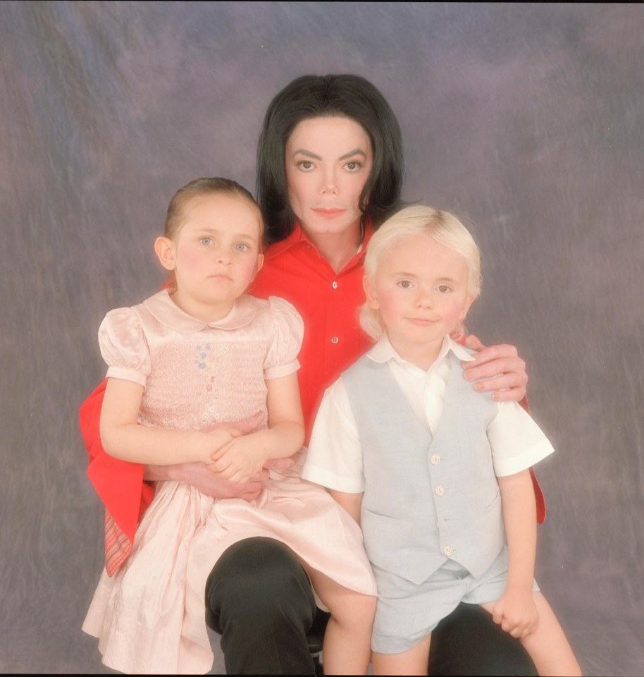Photo of Michael Jackson with his two young children.