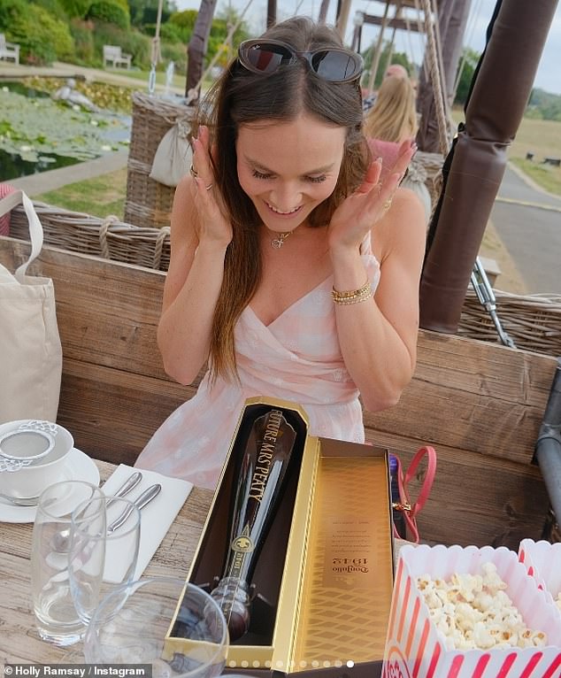 Holly also looked overjoyed as she opened a personalised bottle of Don Julio 1942 tequila which read 'Future Mrs Peaty'
