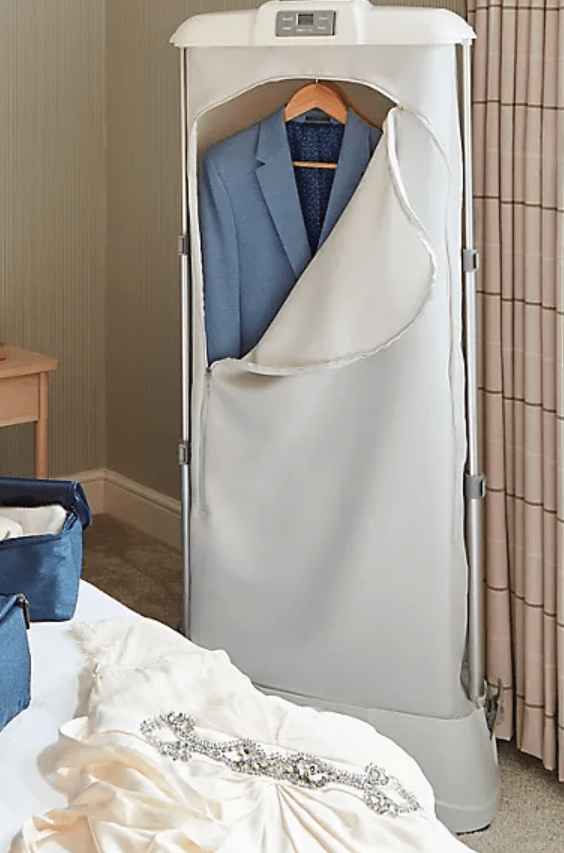 Suit and dress in a garment steamer.