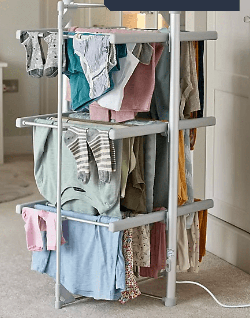 Clothes drying rack with laundry.