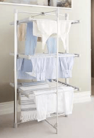 Three-tiered clothes drying rack with clothes drying on it.