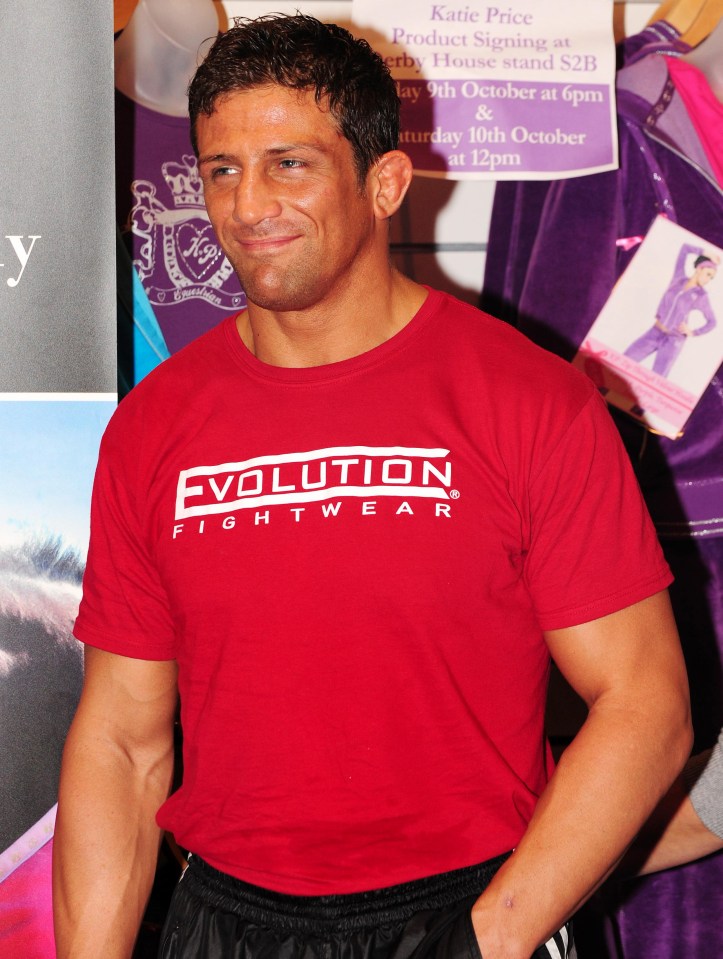 Alex Reid wearing a red Evolution Fightwear shirt.
