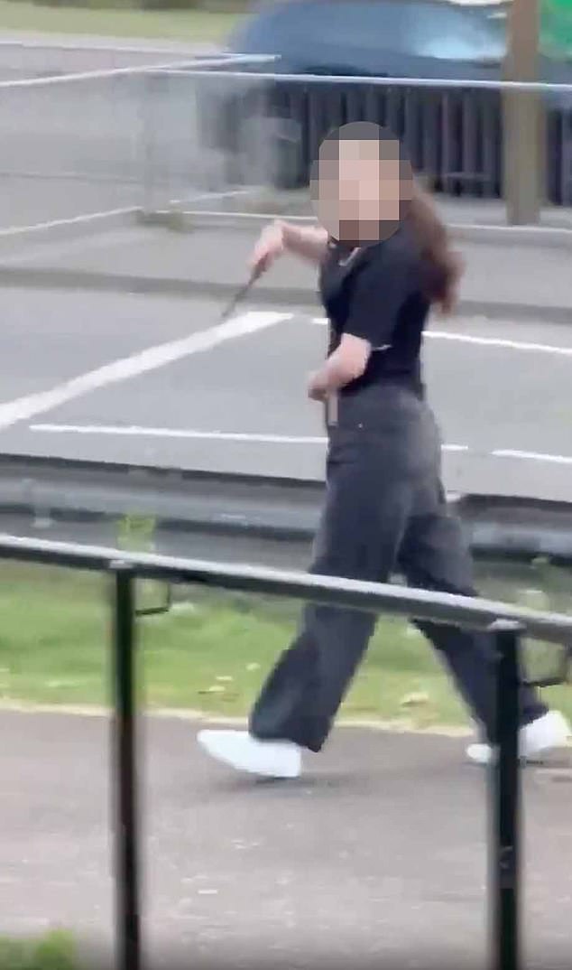 In the video the girl - wearing torn jeans and a navy t-shirt - is being kept away from Mr Dumana by another young female claiming to be her sister