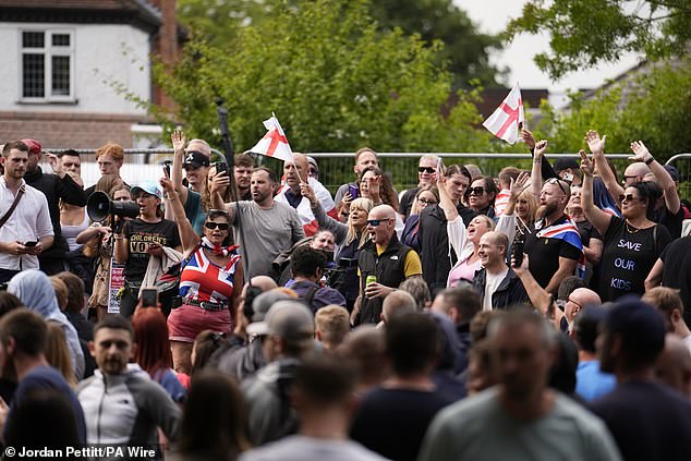 Protesters outside the Bell Hotel in Epping, where asylum seekers have been living, on July 27