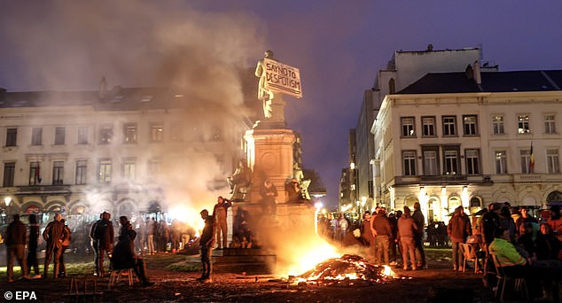Farmers set a fire as they gather in front of the European Parliament during a protest on the sidelines of a EU summit in Brussels, Belgium, 01 February 2024