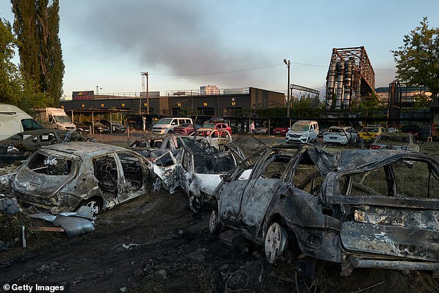 Charred vehicles in the aftermath of Russia's deadly overnight strikes on Kyiv