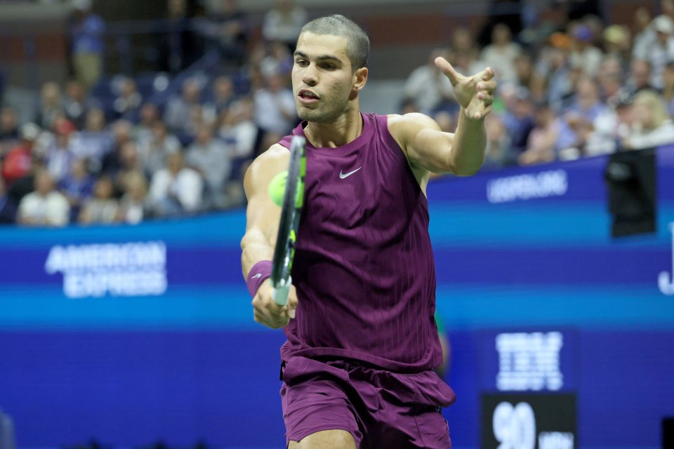 Carlos Alcaraz playing tennis at the US Open.