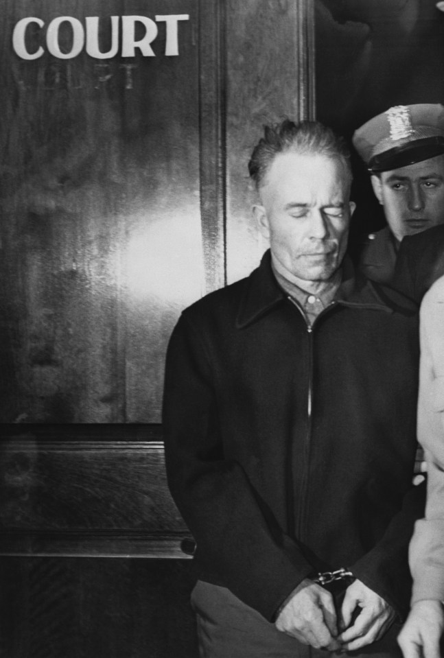 Ed Gein in handcuffs outside a courthouse.