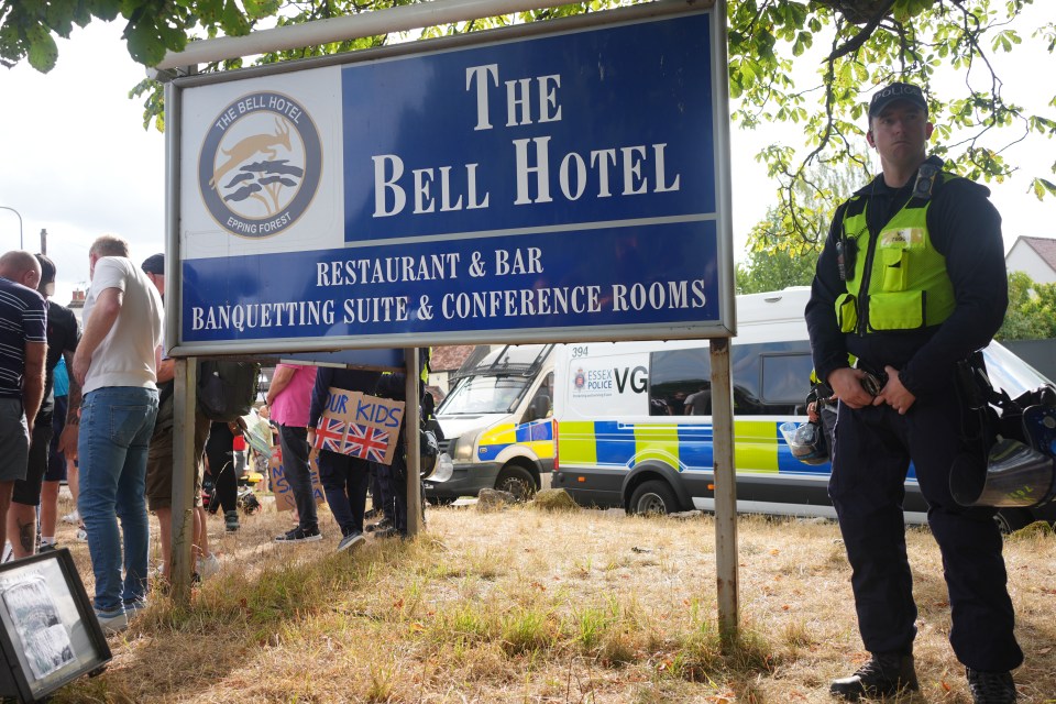 Police officer outside the Bell Hotel during a protest.