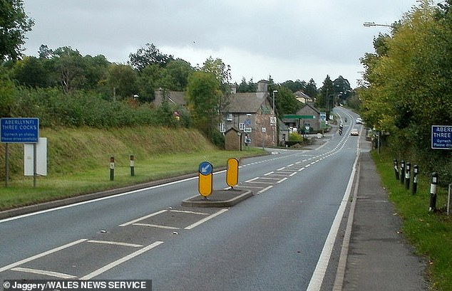 The main road through Three Cocks, with village sign (left) which was used for cycling event