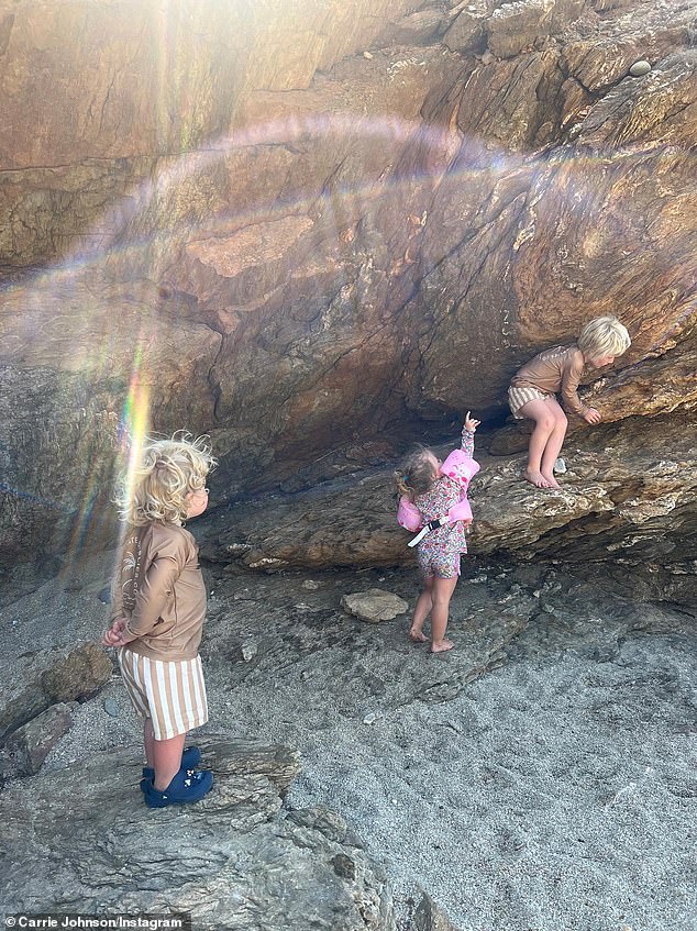 Carrie Johnson shared photos of her three oldest children climbing on rocks together in Greece