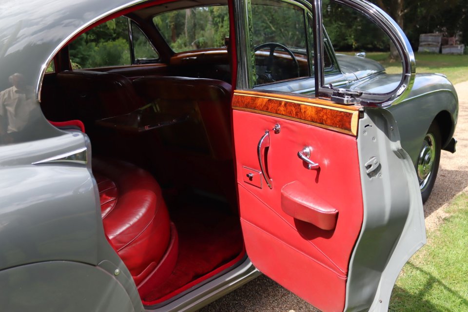 1960 Jaguar Mk IX Saloon interior with open door.
