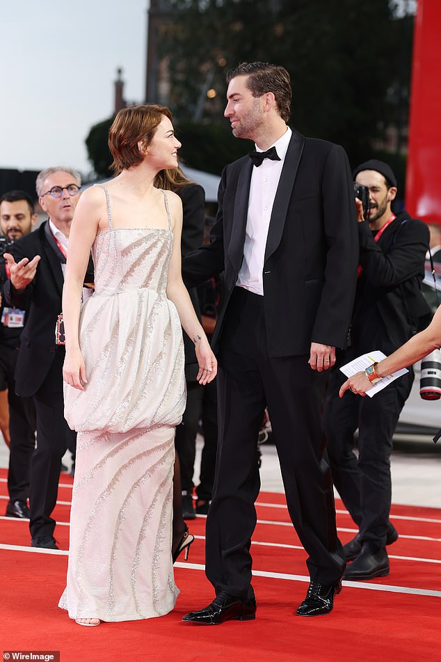 As she walked the red carpet she was joined by her husband Dave, who planted a kiss on her cheek as they posed for snaps