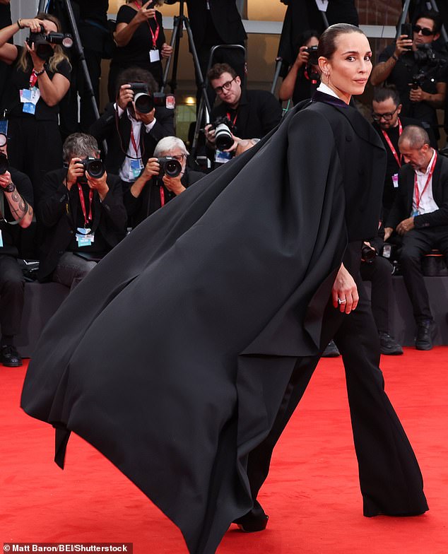 Noomi's blazer featured a cropped style at front paired with a full-length cape style back and split arms