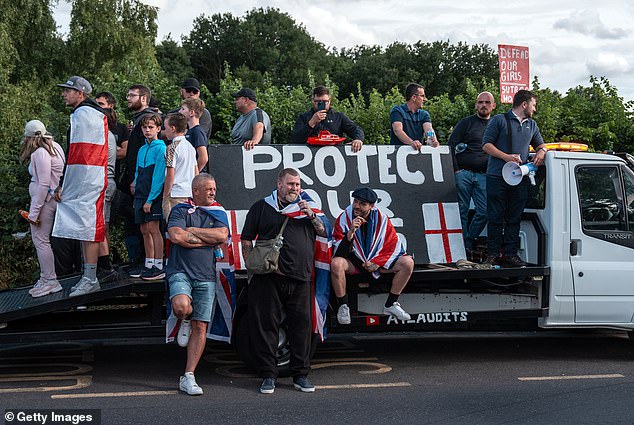 Demonstrators gathered outside the Bell Hotel on July 20, 2025, in Epping perched against a sign that read: 'Protect Our Kids'