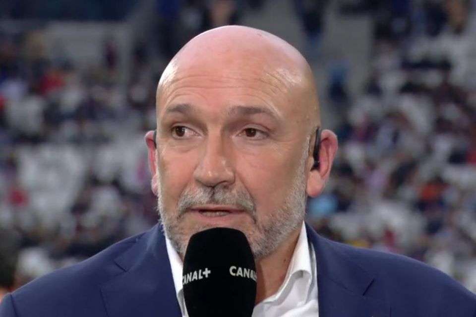 Richard Dourthe speaking into a microphone.
