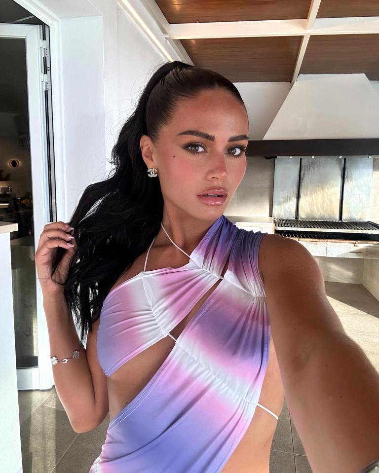 Selfie of Olivia Hawkins wearing a purple and pink tie-dye dress.