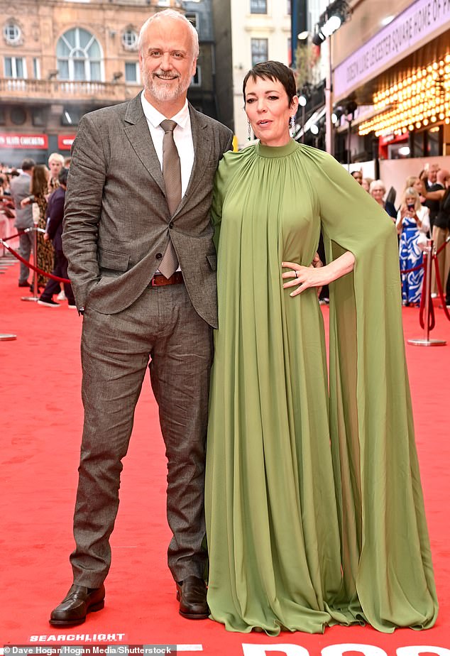 She was joined by her husband Ed Sinclair who posed by her side in a smart brown suit and matching tie