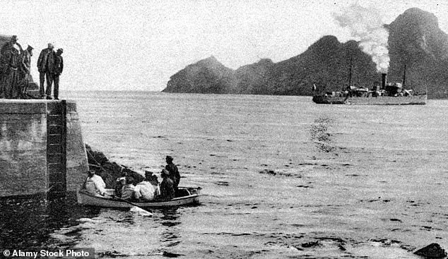 Natives of St Kilda seen in a small boat as they head towards the steamer that would take them to the mainland
