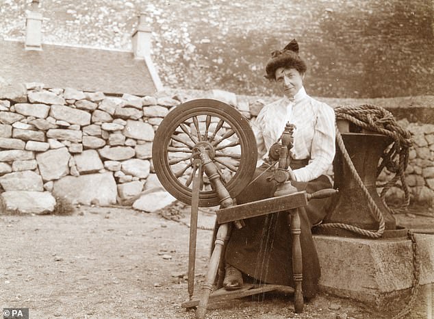 A St Kilda resident sits at her sewing machine