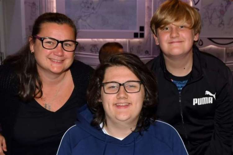 Ethan Entwistle with his mother and brother.