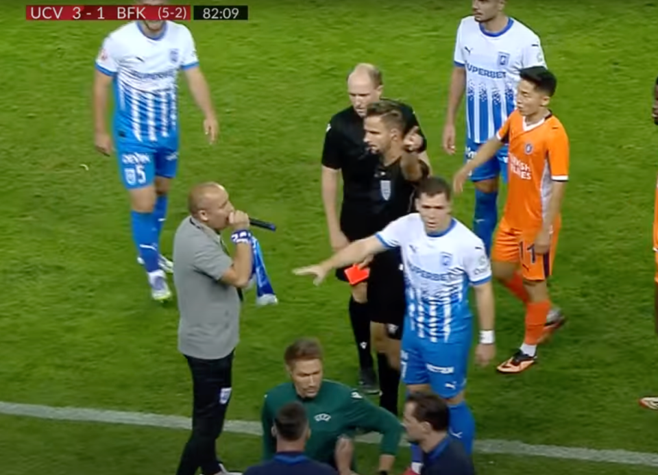 Screenshot of a soccer game where a referee shows a red card to a player.