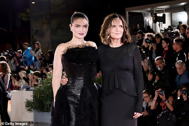 Meanwhile, her mother, Ali, 64, who is married to U2 frontman Bono, cut an equally stylish figure in a floor-length black gown