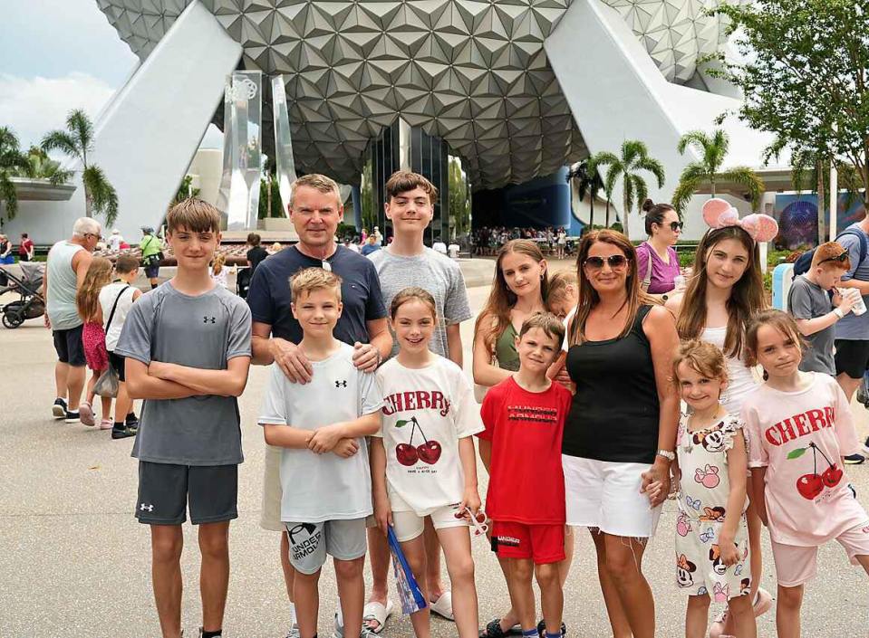 Family portrait in front of Spaceship Earth at Epcot.